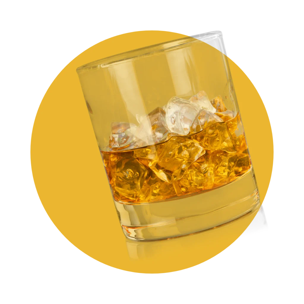 vente-spiritueux-whisky Verre de whisky sur glace, révélant des reflets dorés et des arômes boisés. Découvrez une sélection variée de spiritueux, incluant whiskys, rhums et liqueurs.